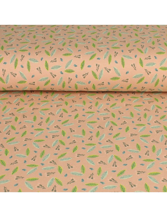 Tissu jersey coton imprimé feuilles vertes rose