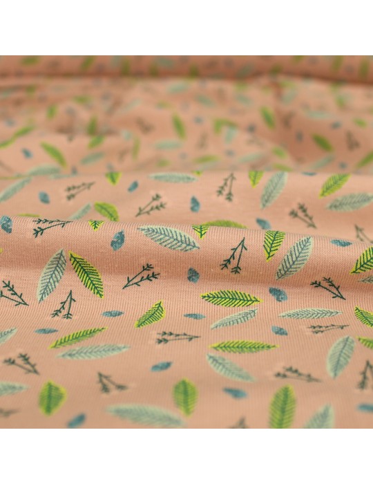Tissu jersey coton imprimé feuilles vertes rose