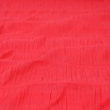 Tissu gaufré brodé corail